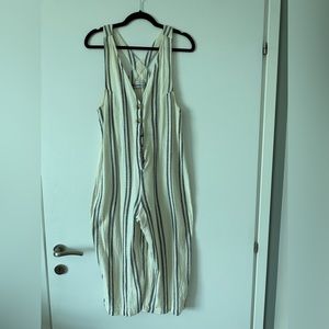 Linen cream jumpsuit with navy stripes. Size medium, fits size 4-6.